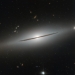 NGC 1032 cleaves the quiet darkness of space in two in this image from the NASA/ESA Hubble Space Telescope.